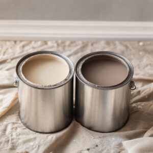 Two paint tins with visible color difference gap